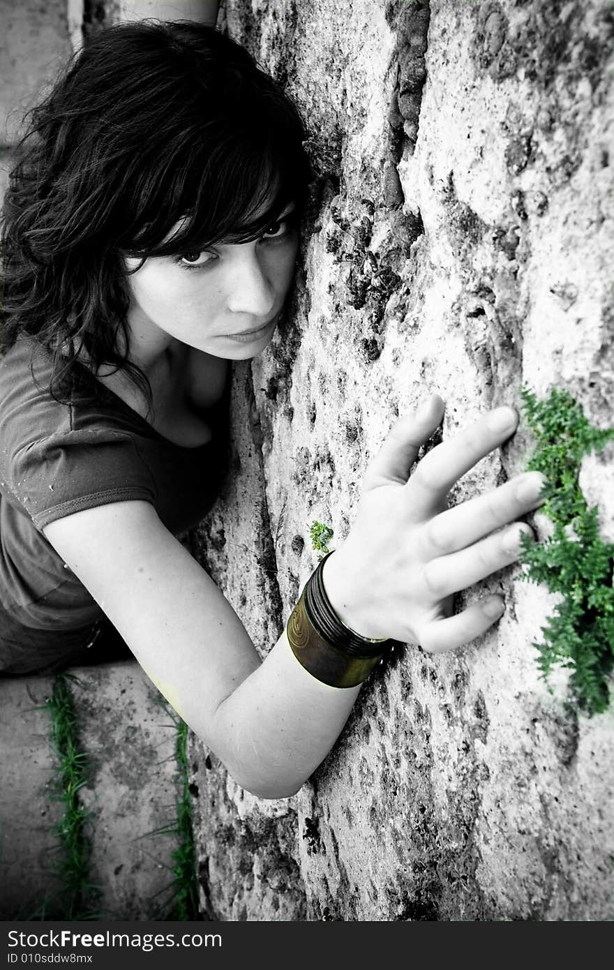 Woman on wall, monochrome with color drops