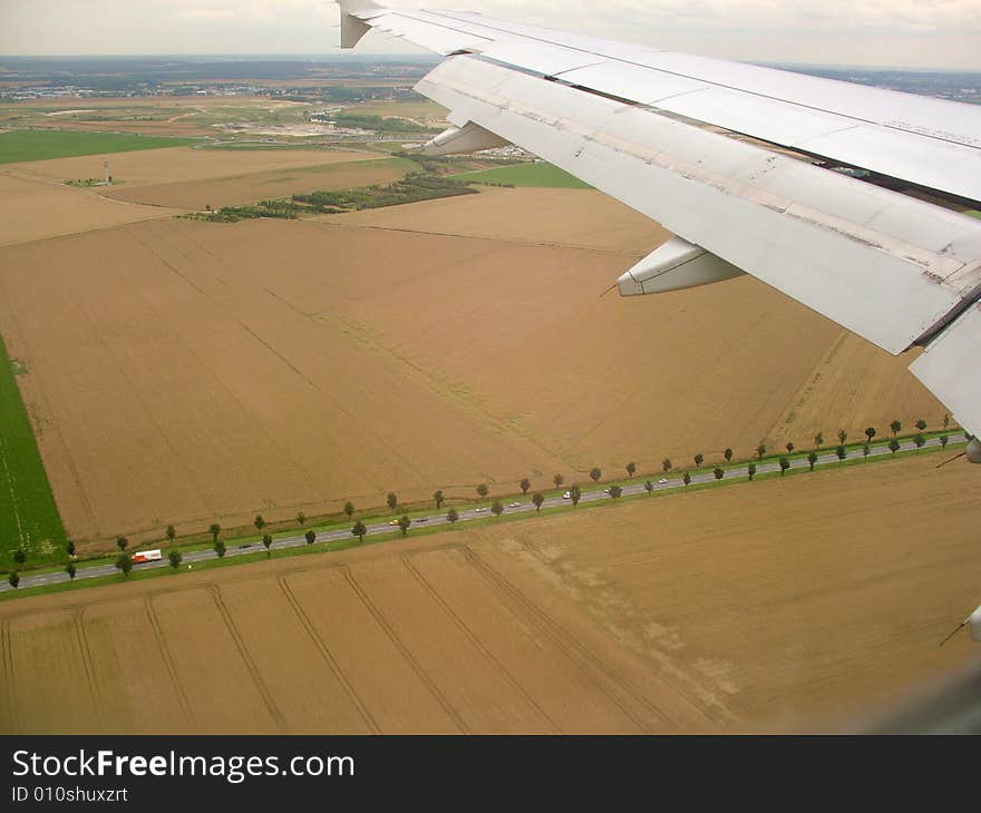 Under the airplane wing