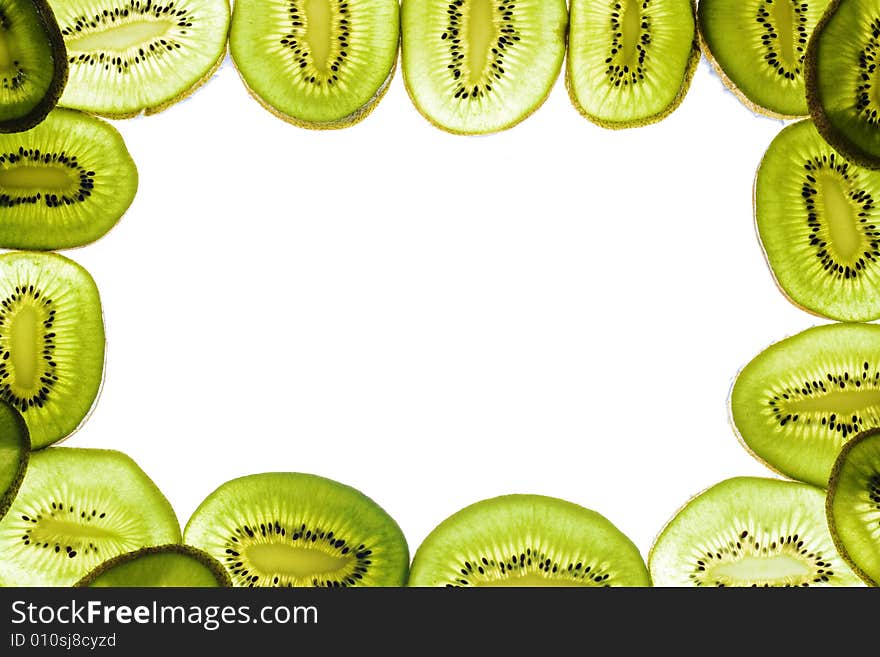 Sliced kiwi on white, frame