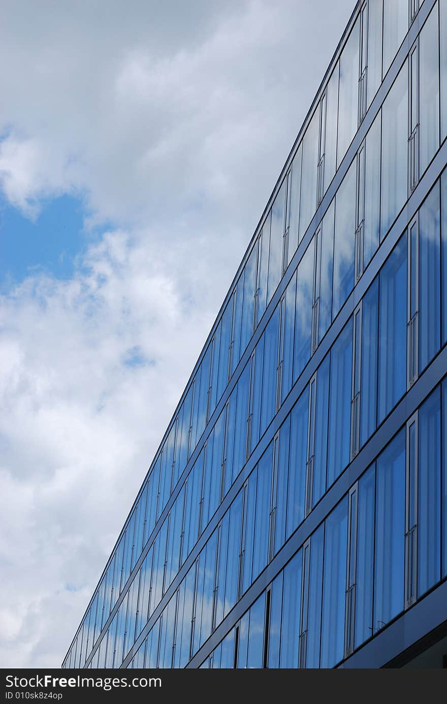 The office building reflect the sky. The office building reflect the sky