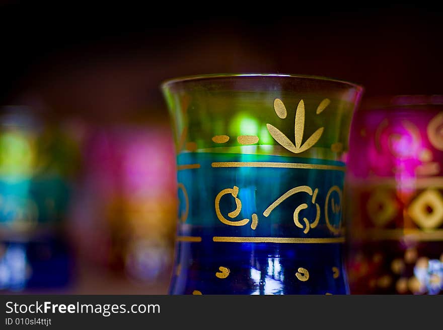 Beautifully decorated antiqye glasses with golden motifs painted on the surface. Beautifully decorated antiqye glasses with golden motifs painted on the surface