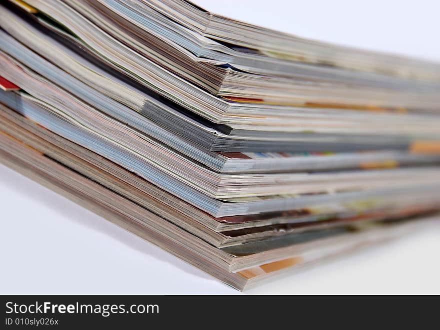 Stack of magazines isolated on white