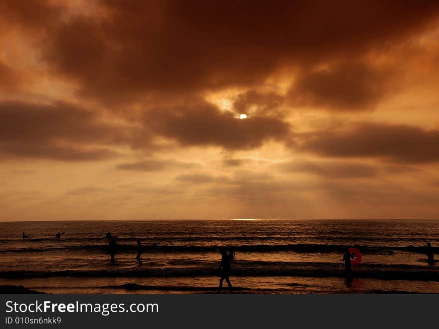 A stunning sunset over the Pacific Ocean shot on a beach in California, USA. A stunning sunset over the Pacific Ocean shot on a beach in California, USA.