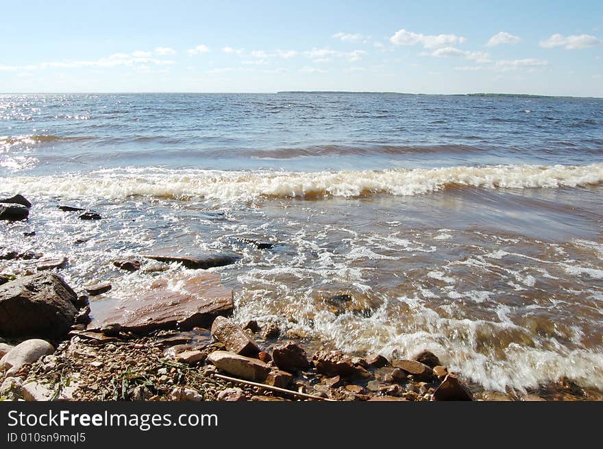 Coast of the river and wave. Coast of the river and wave