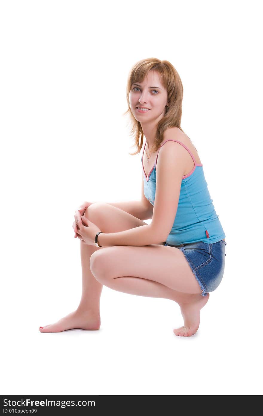 Nice girl carries out sports exercises isolated on a white background