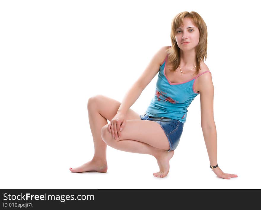 Nice girl carries out sports exercises isolated on a white background. Nice girl carries out sports exercises isolated on a white background