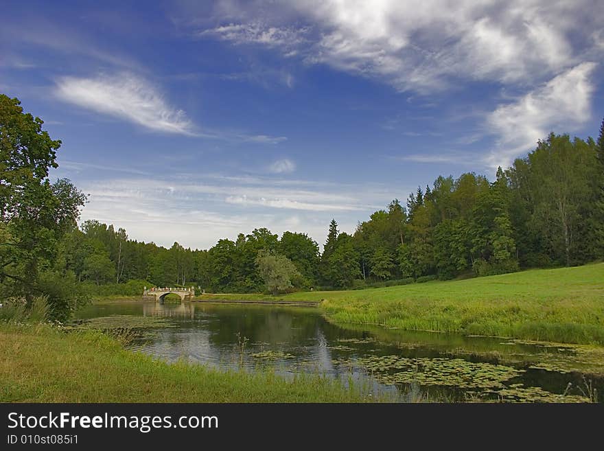 Landscape with blue sky, clouds, forest and lake. Landscape with blue sky, clouds, forest and lake