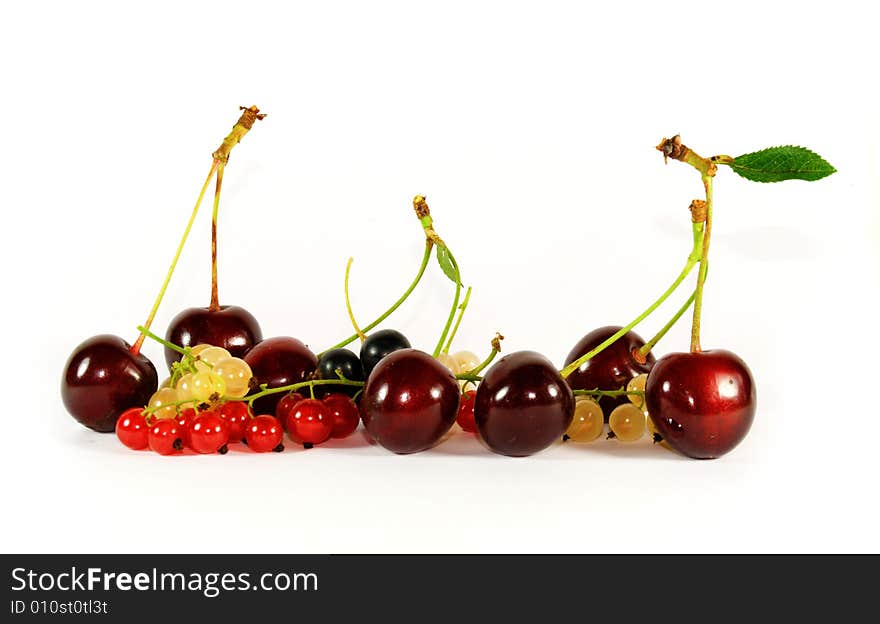 Collage of fruits and berries (horizontal row: cherry, currant, bilberry)