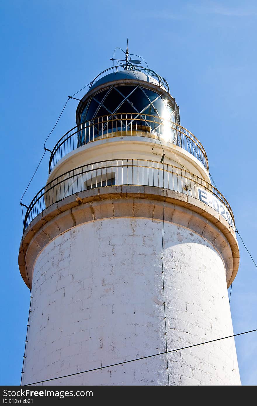 A lighthouse on a blue sky.