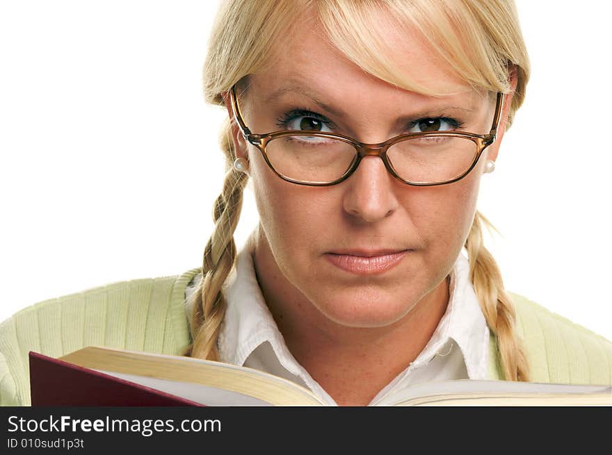 Female With Ponytails Reads Her Book isolated on a White Background. Female With Ponytails Reads Her Book isolated on a White Background.