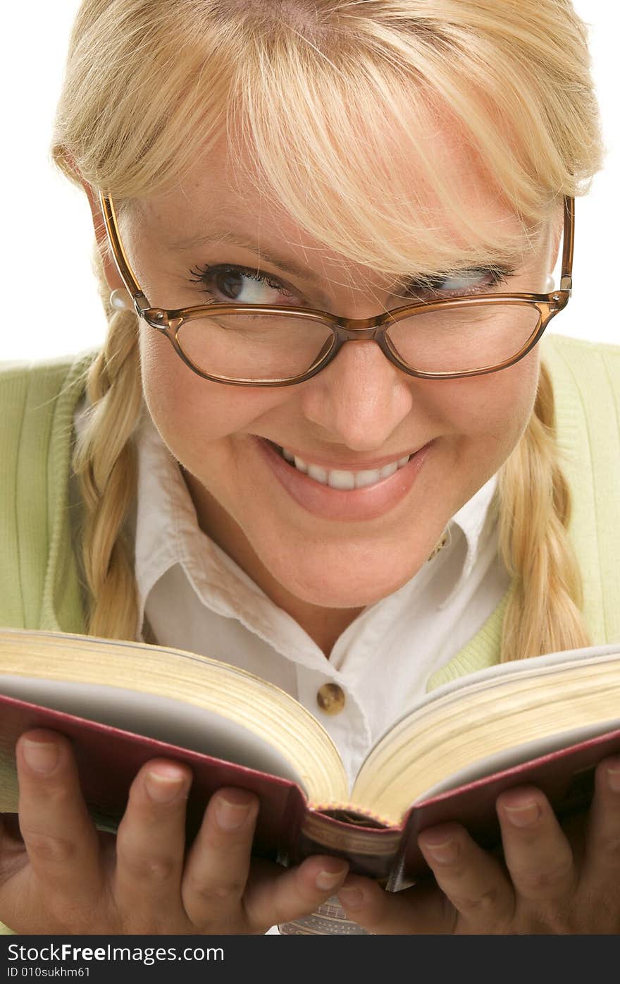 Female With Ponytails Reads Her Book isolated on a White Background. Female With Ponytails Reads Her Book isolated on a White Background.