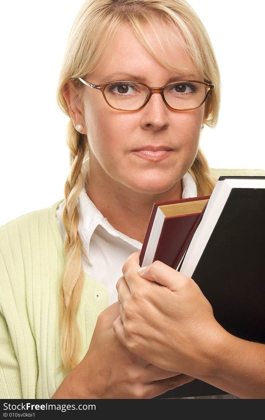 Attractive Woman with a Stack of Books Isolated on a White Background. Attractive Woman with a Stack of Books Isolated on a White Background.