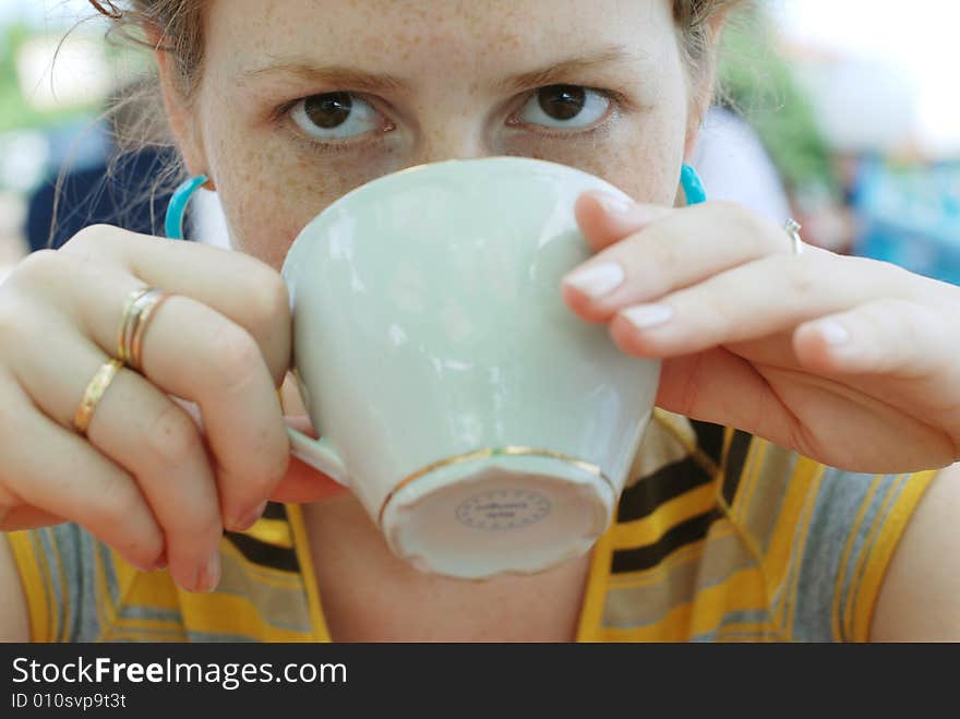 Girl drinking coffee in the cafe