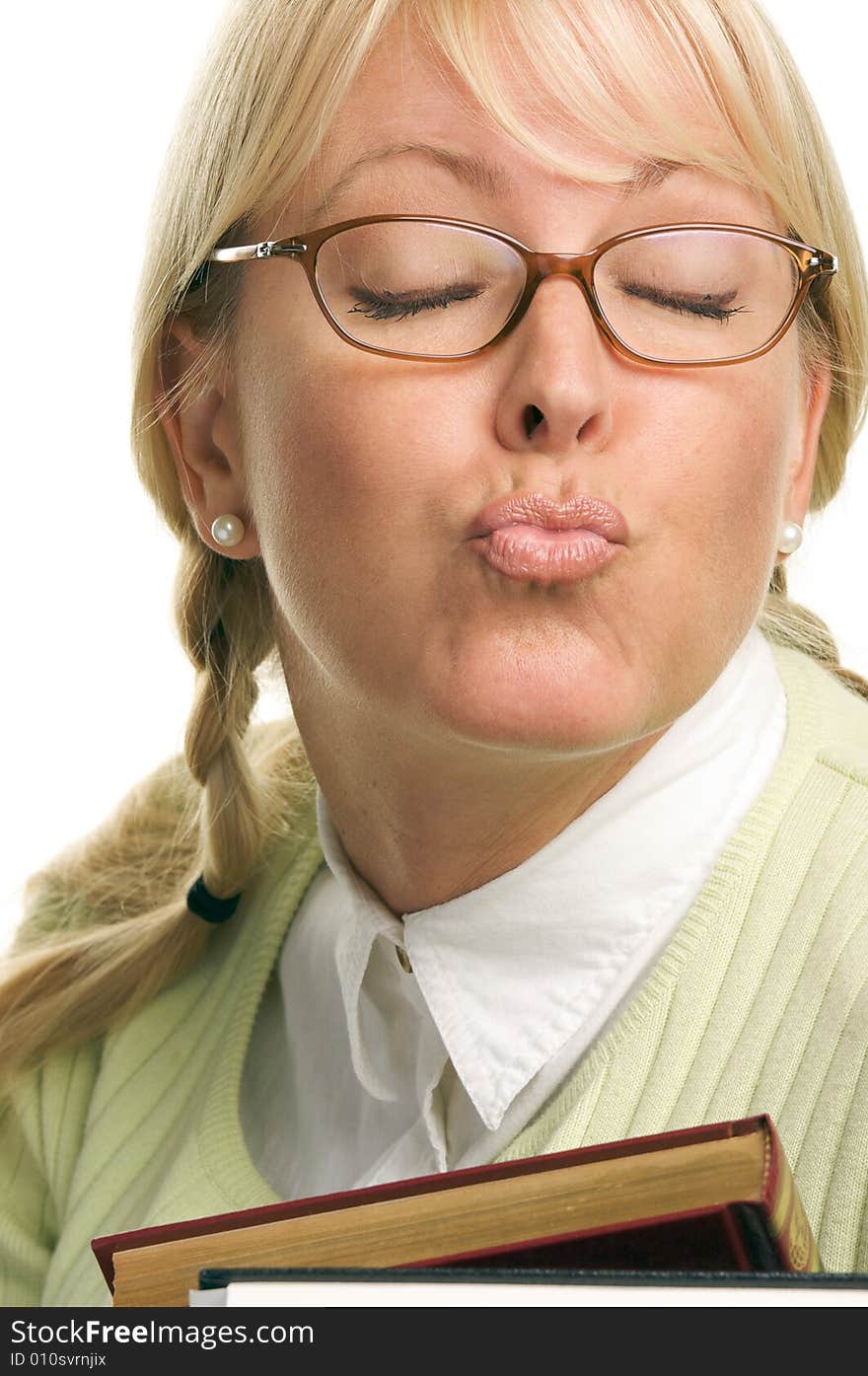 Beautiful Woman Puckers & Carries Stack of Books