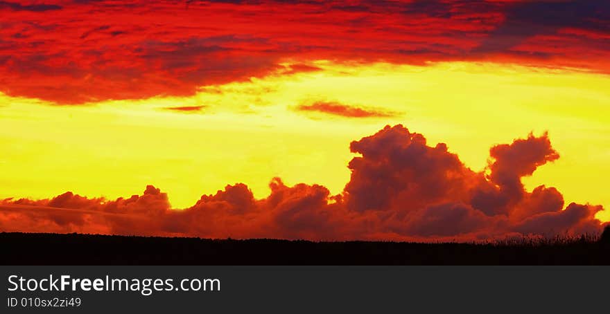 Clouds on the sunset in the form of the dragon of that lying on the earth. Illustration. Clouds on the sunset in the form of the dragon of that lying on the earth. Illustration.