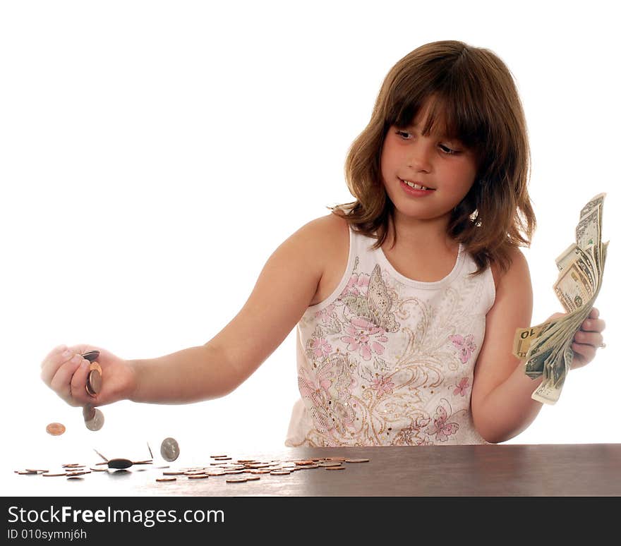 Elementary girl happily counting her money. Elementary girl happily counting her money.