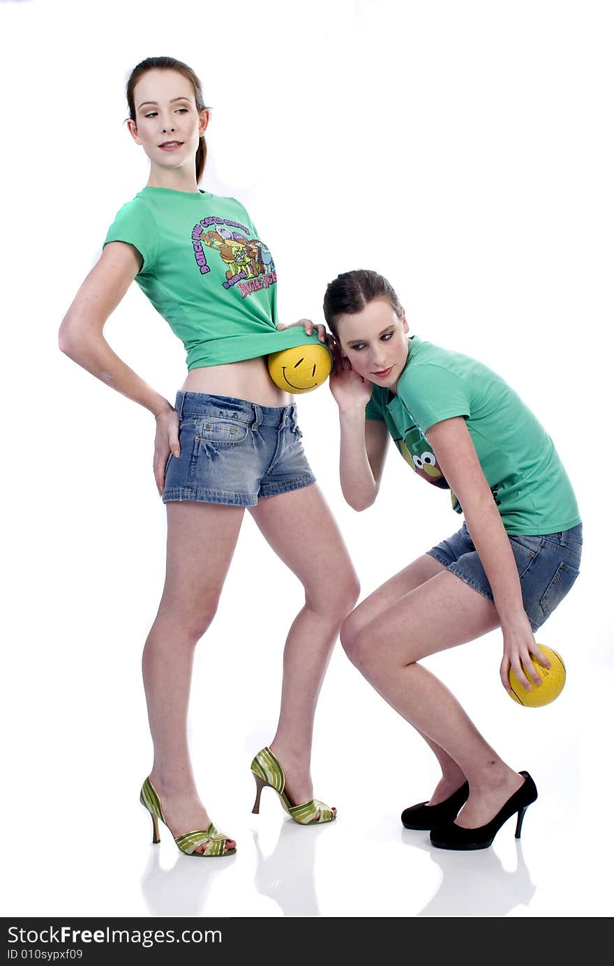 Two girls playing with balls. Two girls playing with balls