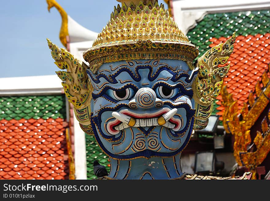 Thailand Bangkok; the wat Phra Kaew shelter the most sacred image of Thailand the Emerald Buddha. The temple is situated in the northeast corner of the Grand Palace. View of a giant or yakshas. Thailand Bangkok; the wat Phra Kaew shelter the most sacred image of Thailand the Emerald Buddha. The temple is situated in the northeast corner of the Grand Palace. View of a giant or yakshas