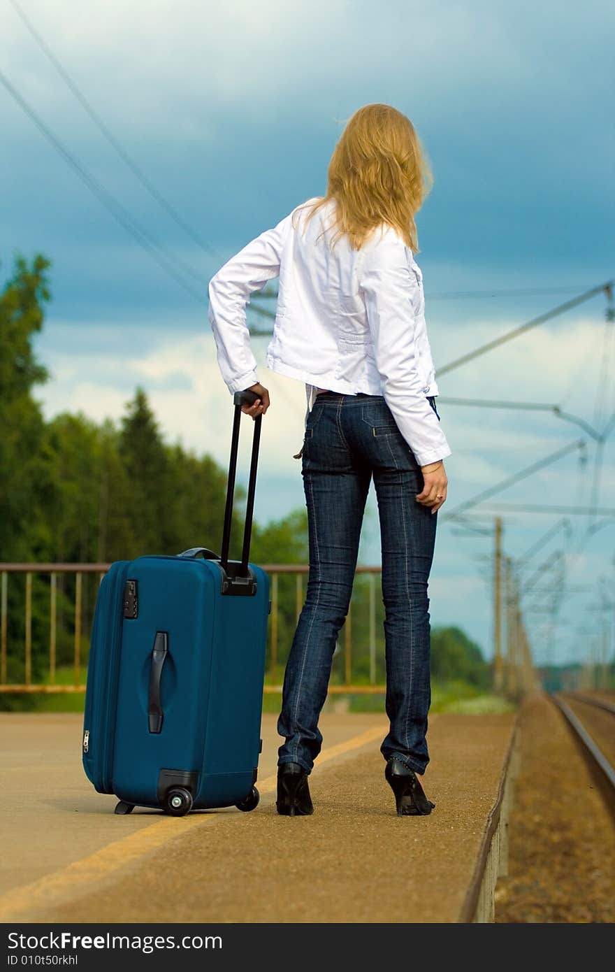 Young lady waiting a train