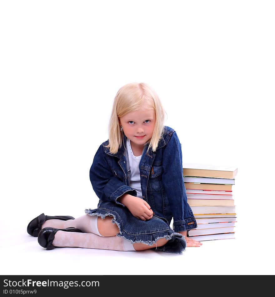 Litlle girl and the stack of books. Litlle girl and the stack of books