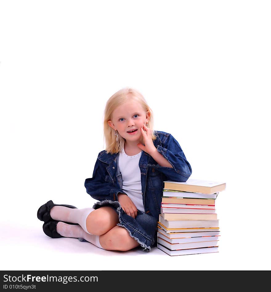 Litlle girl and the stack of books isolated on white. Litlle girl and the stack of books isolated on white