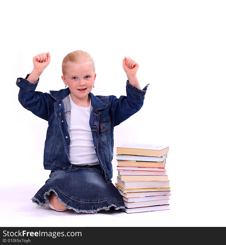 Litlle girl and the stack of books isolated on white. Litlle girl and the stack of books isolated on white