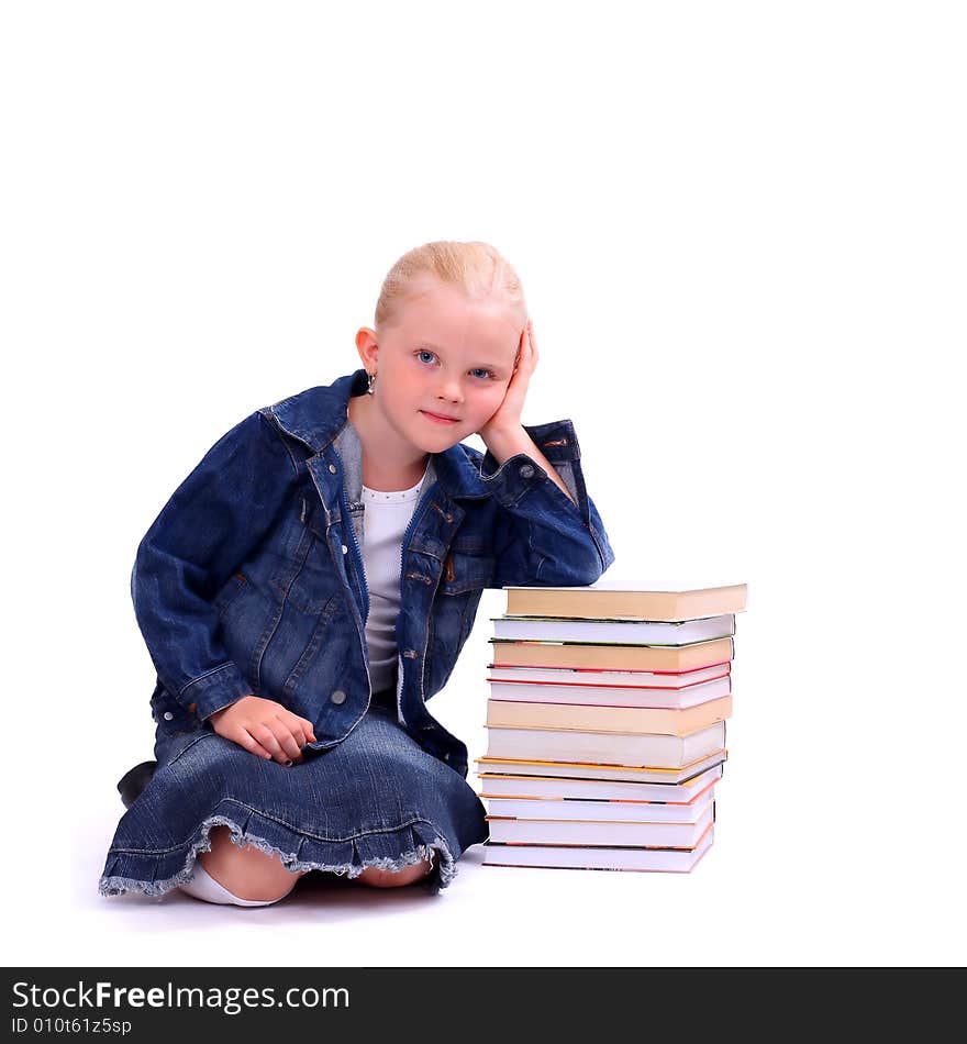 Litlle girl and the stack of books isolated on white. Litlle girl and the stack of books isolated on white