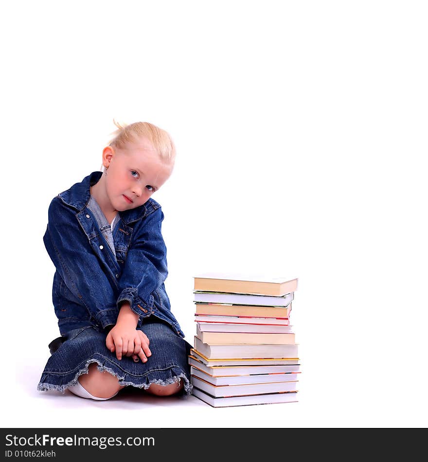 Litlle girl and the stack of books isolated on white. Litlle girl and the stack of books isolated on white