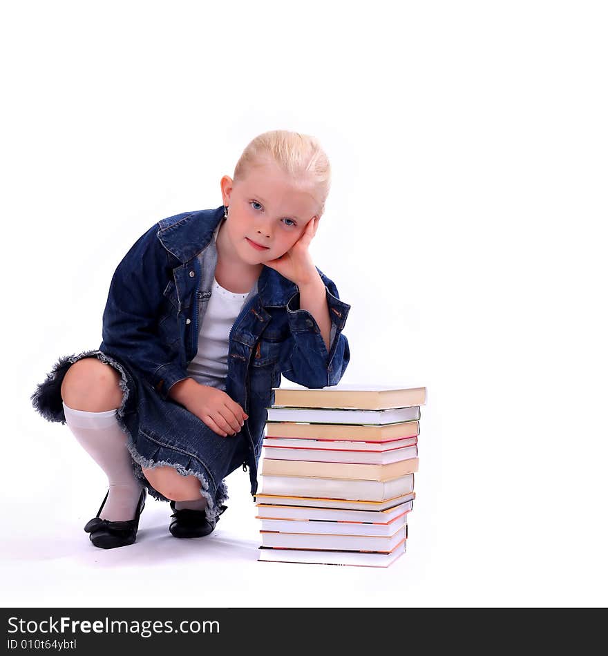 Litlle girl and the stack of books isolated on white. Litlle girl and the stack of books isolated on white