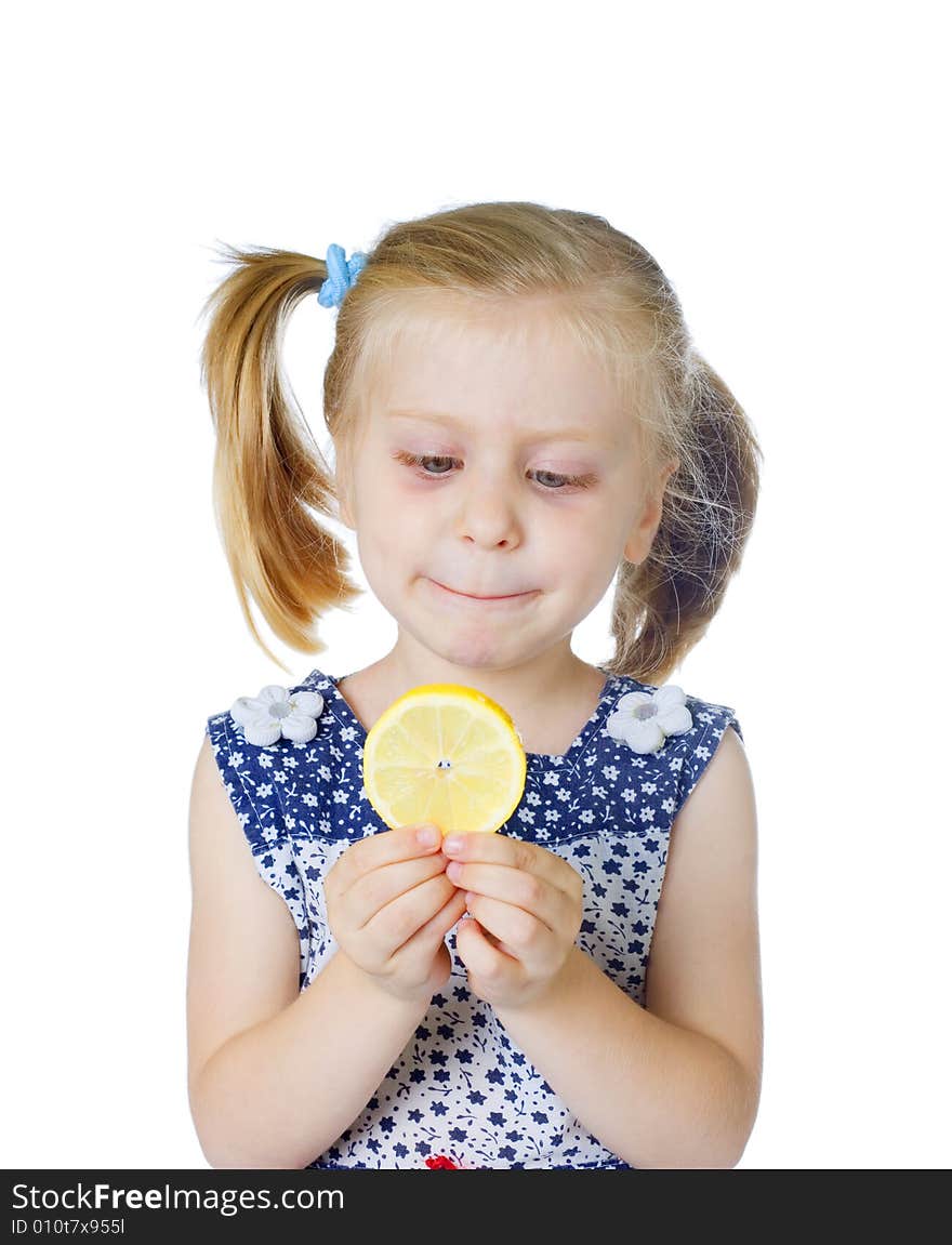 Little cute girl eating fresh lemon, isolated on white background