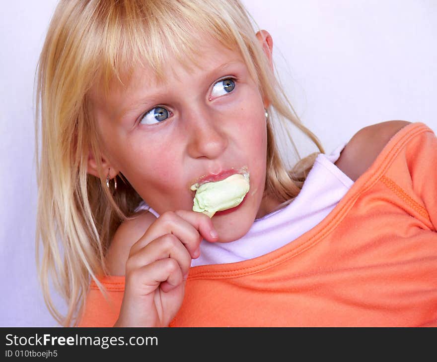 Adorable girl eating an ice cream. Adorable girl eating an ice cream