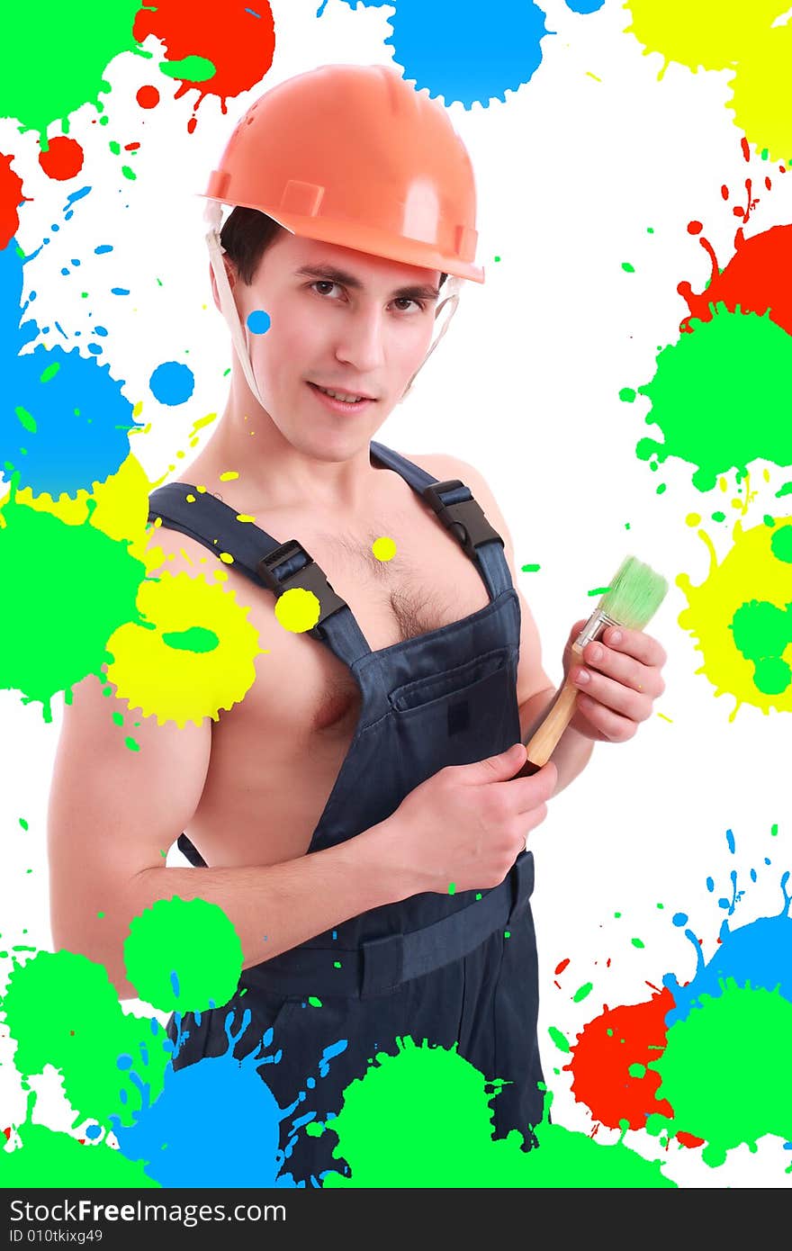 Muscular young man in a builder uniform with tools. Muscular young man in a builder uniform with tools.