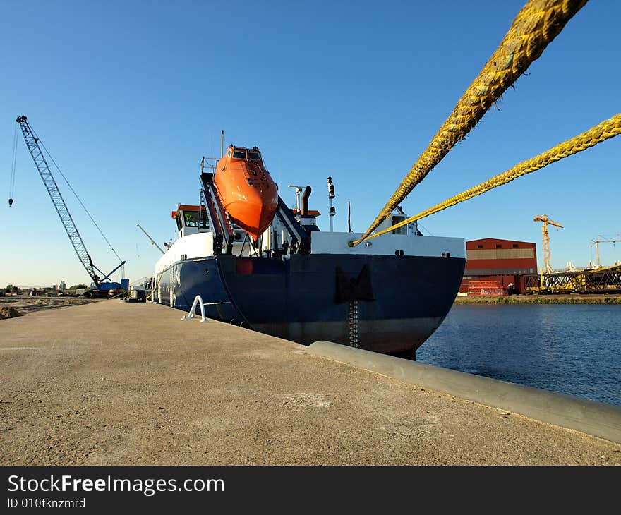 Freighter moored alongside the wharf. Freighter moored alongside the wharf