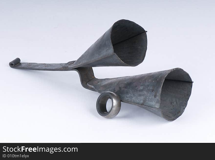 A hand crafted set of iron bells used as a musical instrument for percussion. The ring is placed on the thumb and used to tap the pod producing a clangy sound. A hand crafted set of iron bells used as a musical instrument for percussion. The ring is placed on the thumb and used to tap the pod producing a clangy sound