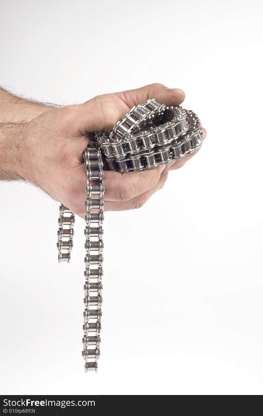 Hands with metal link chain on a white background