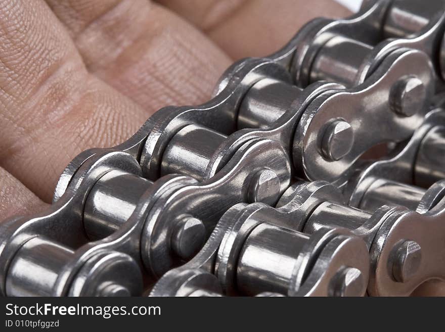 Close up of hand with metal link chain