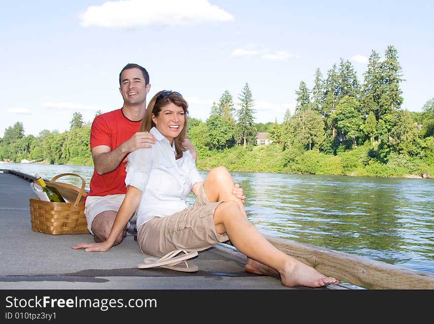 Couple Having a Picnic by the Lake - Horizontal