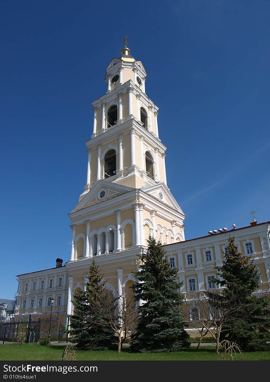 Belltower of an orthodox monastery in Diveevo on a background of the dark blue sky