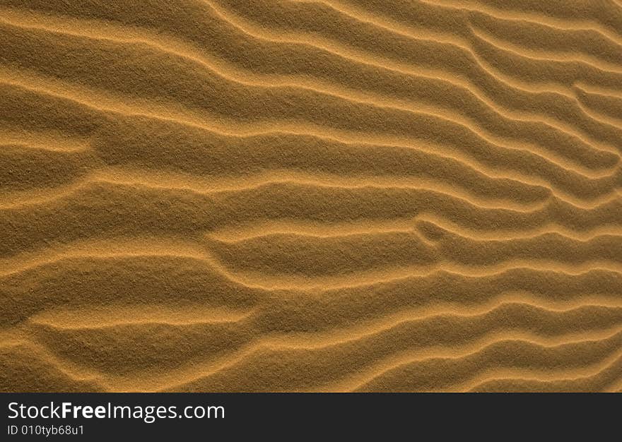 Lines of shadow and lignt on the yellow sand. Lines of shadow and lignt on the yellow sand