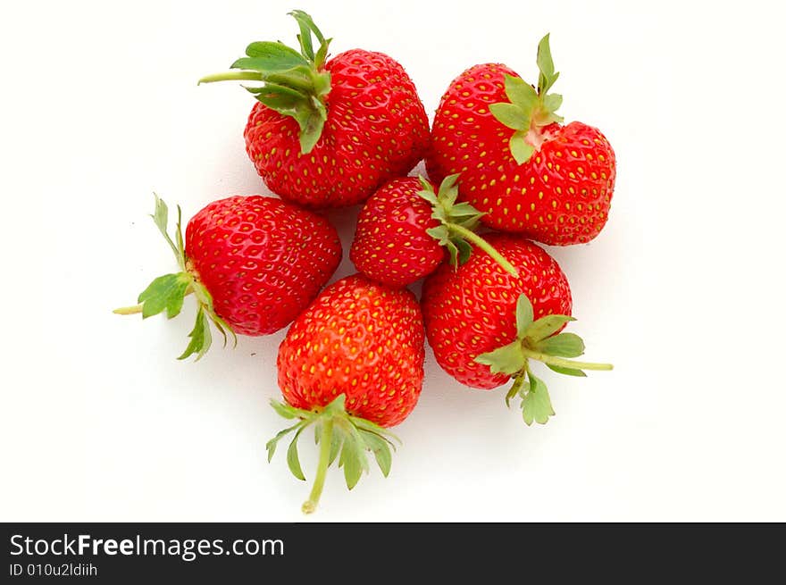 Set of fresh strawberries on white painted board