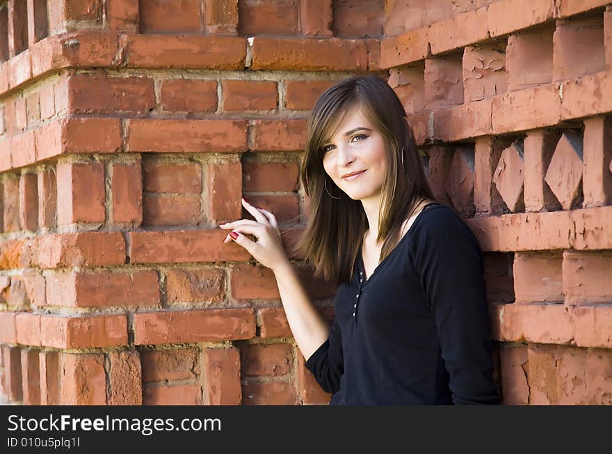 Happy Teenager Girl Against Brick Wall. Happy Teenager Girl Against Brick Wall