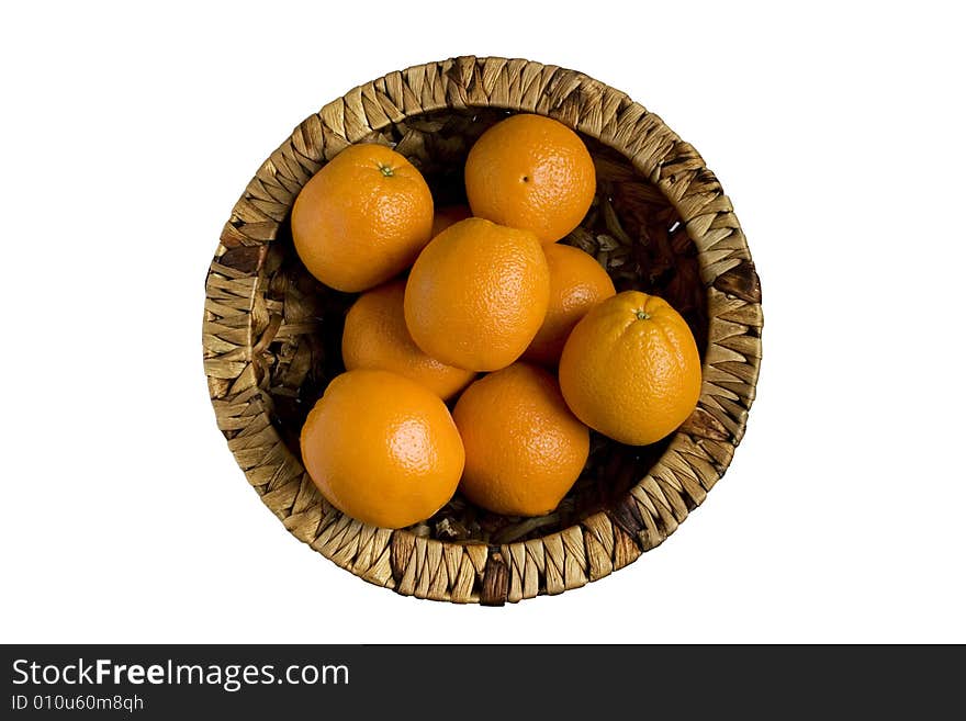 Oranges in basket are isolated on white background