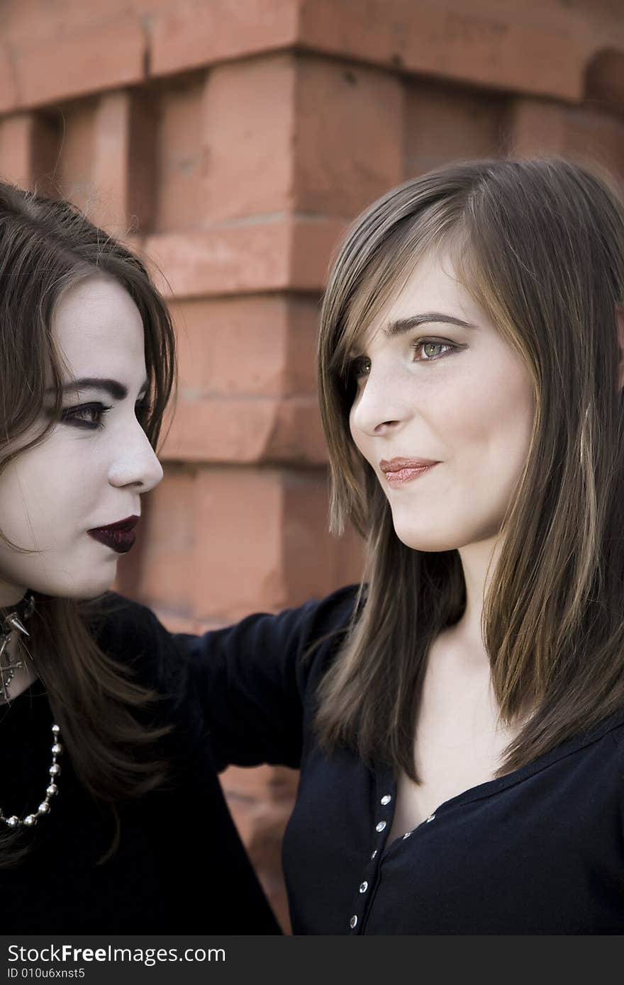 Two Teenage Girls Relaxing Outdoors. Two Teenage Girls Relaxing Outdoors