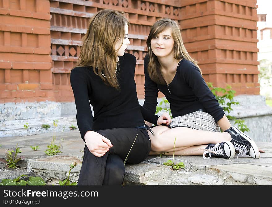 Two Modern Style Teenagers Outdoors. Two Modern Style Teenagers Outdoors