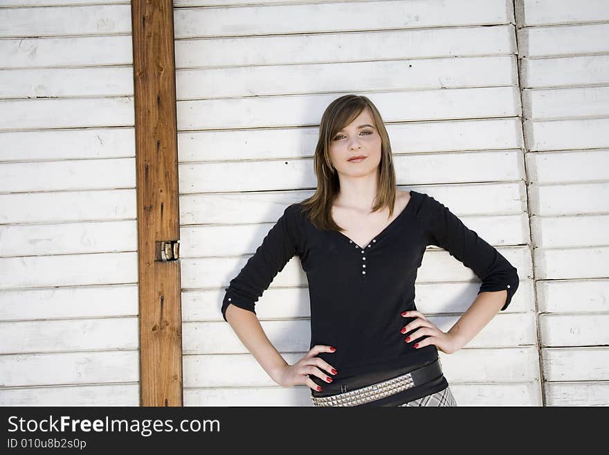 Beauty Girl Portrait On The Wooden Background