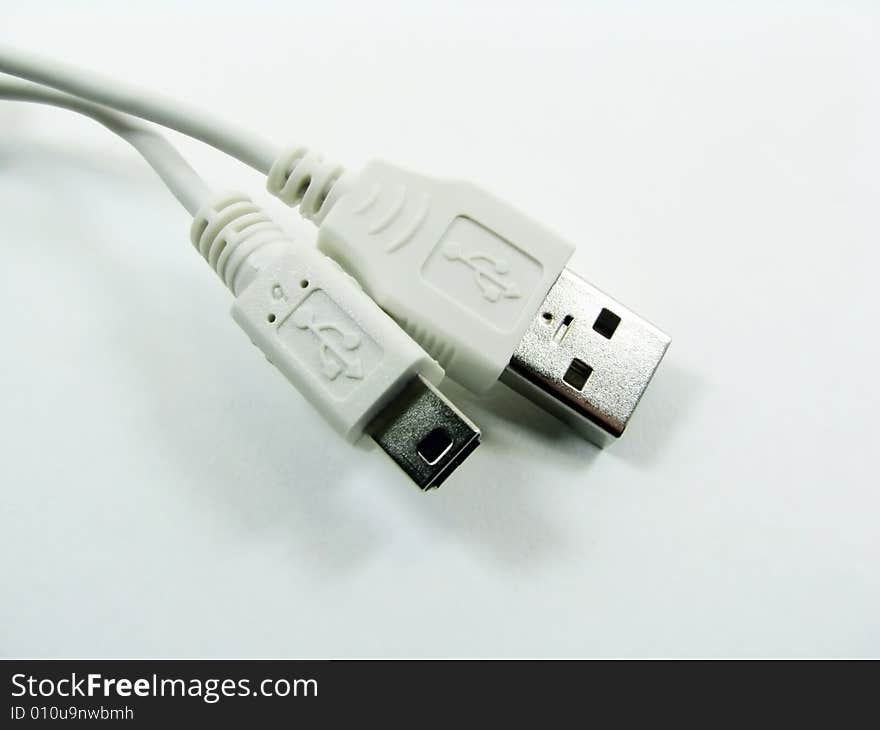 A white usb computer cable. A white usb computer cable.