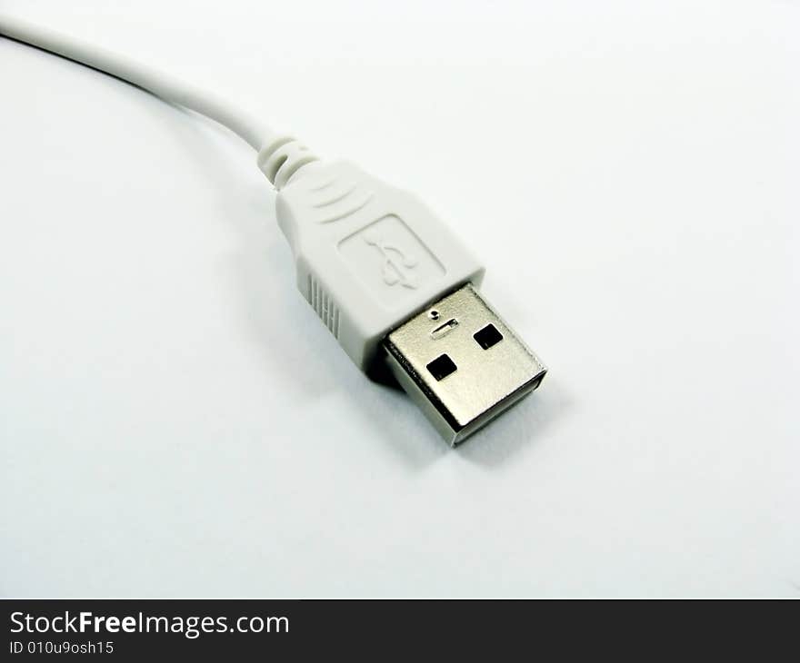 A white usb computer cable. A white usb computer cable.