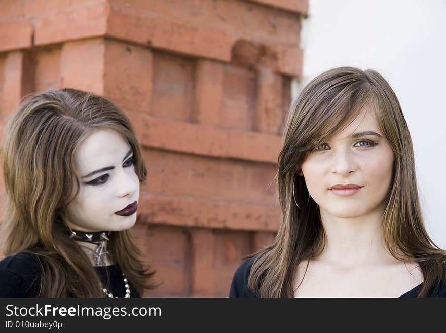 Teenagers Portrait On The Brick Background