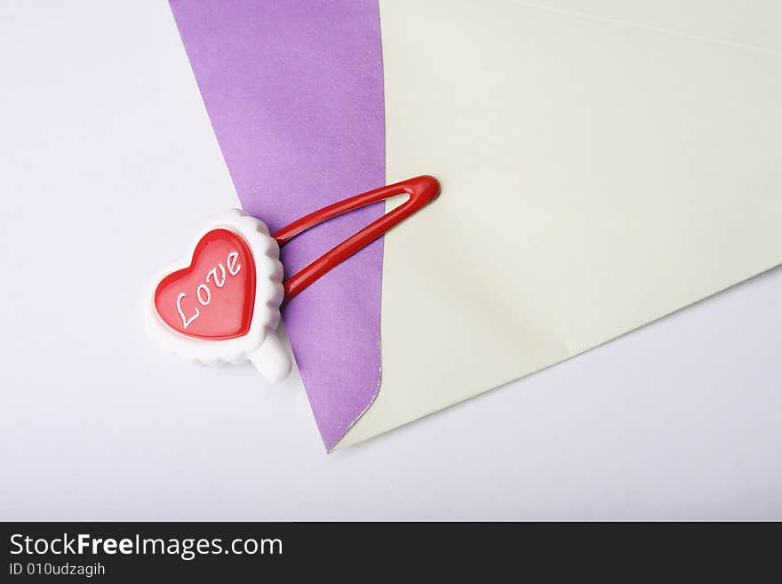 'love' on red heart shape clip with envelope. 'love' on red heart shape clip with envelope