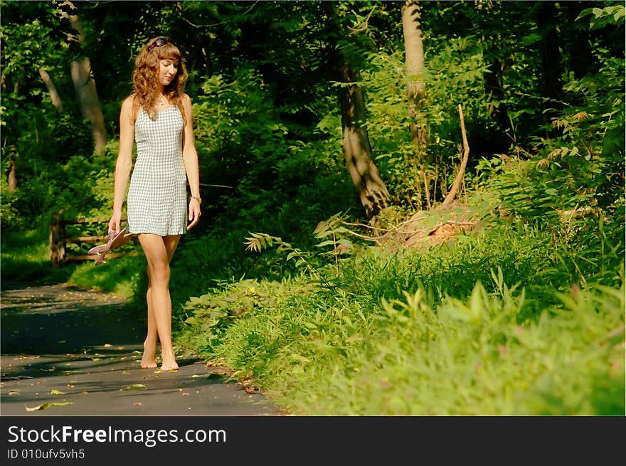 Pretty girl on forested pathway. Pretty girl on forested pathway.